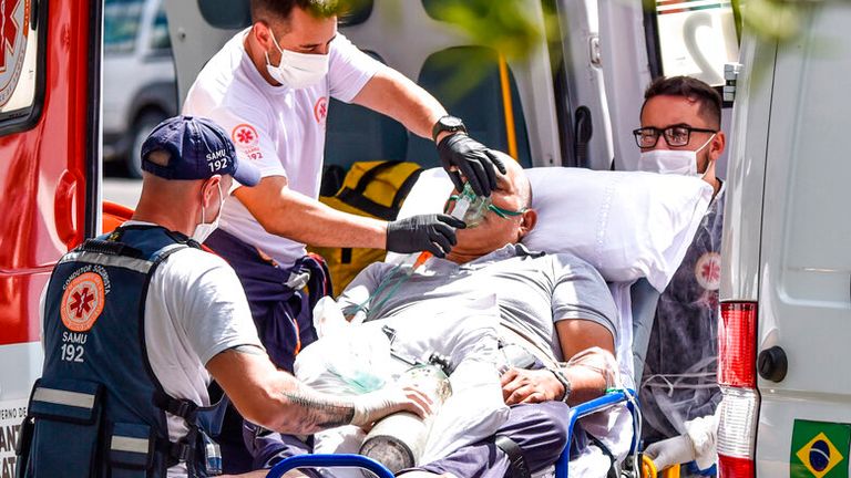 A man with COVID symptoms arrives at a medical facility in Lages, Santa Catarina state. Pic: AP