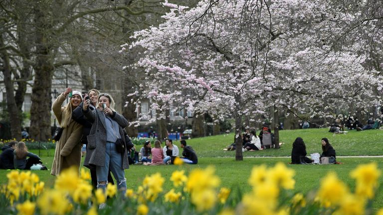 People relax in St. James&#39;s Park, ahead of lockdown restrictions being eased, amid the spread of the coronavirus disease (COVID-19) pandemic, London