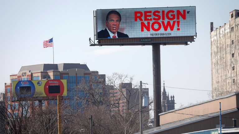 An electronic billboard displays a message that reads "Resign Now" for New York Governor Andrew Cuomo, in the wake of allegations that he sexually harassed young women, in Albany, New York, U.S., March 3, 2021. REUTERS/Mike Segar