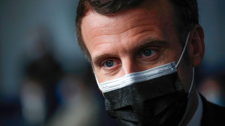 French President Emmanuel Macron listening to people after they received a Pfizer COVID-19 vaccine at the vaccination center of Valenciennes, northern France, Tuesday, March 23, 2021. The French government has backed off from ordering a tough lockdown for Paris and several other regions despite an increasingly alarming situation at hospitals with a rise in the number of COVID-19 patients. (Yoan Valat/Pool Photo via AP)