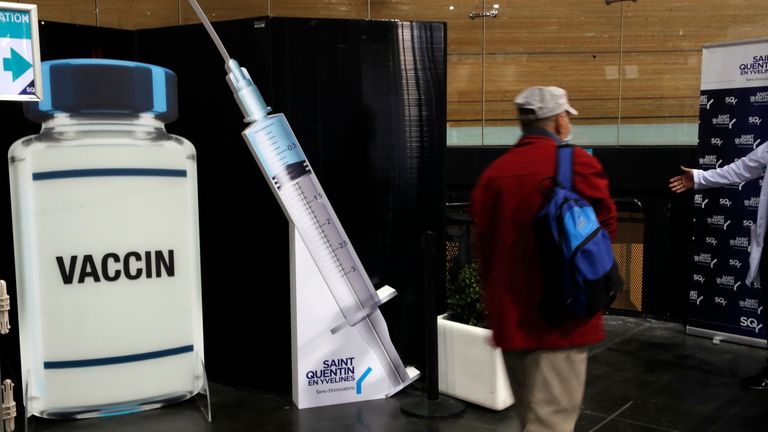 A man leaves after he received Pfizer&#39;s COVID-19 vaccine at the Saint Quentin en Yvelines velodrome, used as a Covid-19 vaccination site, outside Paris, Wednesday, March 24, 2021. French President Emmanuel Macron, on Tuesday announced an acceleration of the country&#39;s vaccination campaign, which has been criticized as too slow. (AP Photo/Christophe Ena)