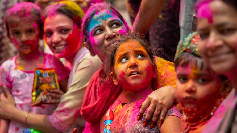 Hindus threw colored powder and sprayed water in massive Holi celebrations Monday despite many Indian states restricting gatherings to try to contain a coronavirus resurgence rippling across the country. Pic: AP