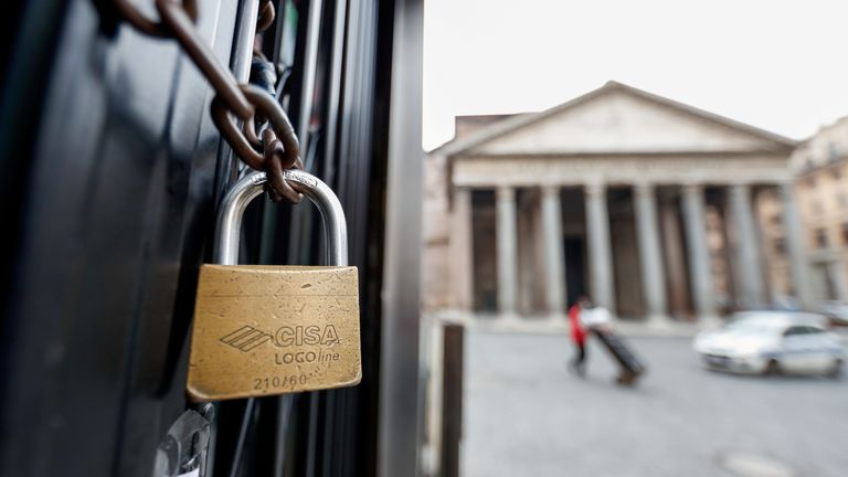 A padlock is seen on the door of a closed restaurant near the Pantheon, as the region enters the &#39;yellow zone&#39; after the government relaxed some of the coronavirus disease (COVID-19) curbs on weekdays following a strict lockdown over the holidays, in Rome, Italy January 7, 2021