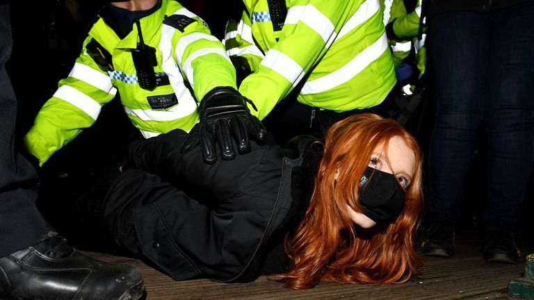 A woman is arrested at a vigil in memory of Sarah Everard. Pic: James Veysey/Shutterstock