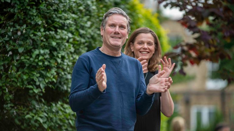 Sir Keir Starmer and his wife Victoria clapping for the NHS