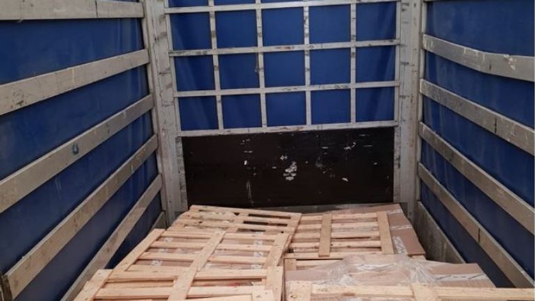 Seventeen migrants were found in this trailer. Pic: NCA