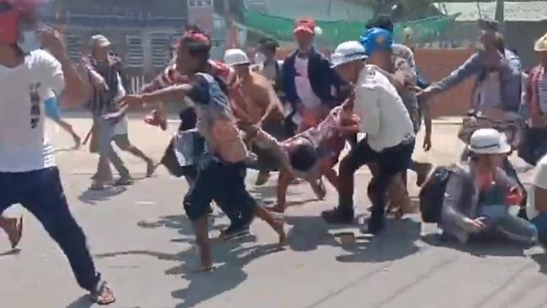 Protesters in Yangon Carry Injured Man Away From Clashes
