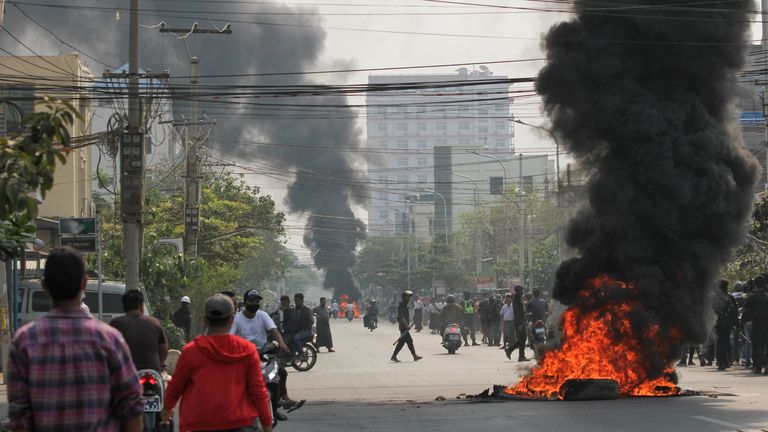 Tires burn on a street as protests against the military coup continue, in Mandalay, Myanmar March 27, 2021. REUTERS/Stringer
