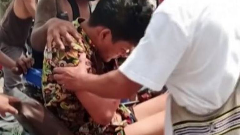 Man is aided away from grenade blast in a rickshaw in Myanmar