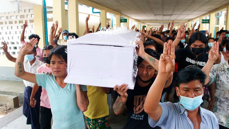 People carry the coffin of a man who was killed during a clash with Myanmar's security forces