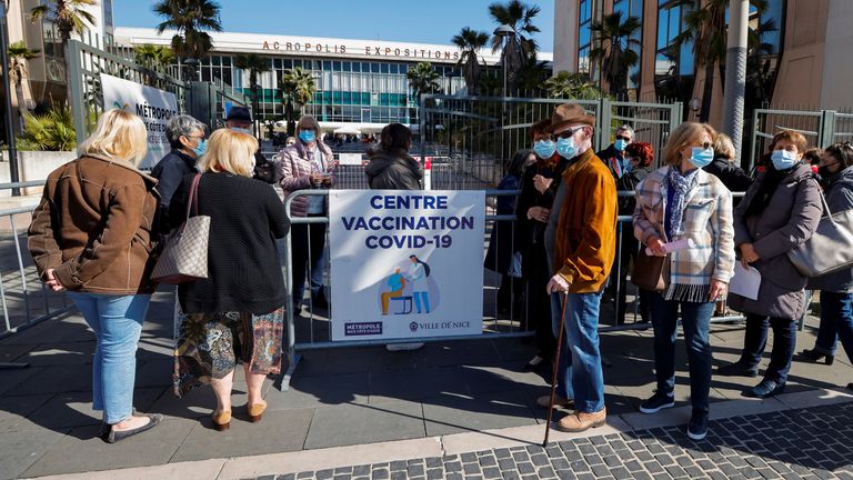 People wait to enter a vaccination center inside the exhibition palace as part of the coronavirus disease (COVID-19) vaccination campaign in Nice, France, March 13, 2021. REUTERS/Eric Gaillard