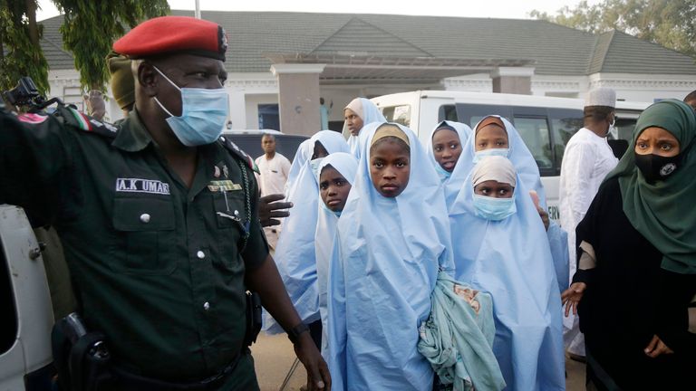 Some of the students who were abducted by gunmen from the Government Girls Secondary School, in Jangebe, last week wait for a medical checkup after their release meeting with the state Governor Bello Matawalle, in Gusau, northern Nigeria, Tuesday, March 2, 2021. Zamfara state governor Bello Matawalle announced that 279 girls who were abducted last week from a boarding school in the northwestern Zamfara state have been released Tuesday.(AP Photo/Sunday Alamba)