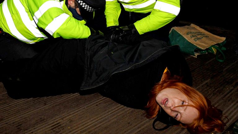 Mandatory Credit: Photo by James Veysey/Shutterstock (11798757w)
A woman is arrested at a vigil in memory of murdered Sarah Everard. Patsy Stevenson
Sarah Everard vigil, Clapham, London, UK - 13 Mar 2021