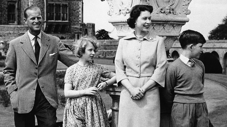 Charles and Anne join their parents for a spring walk at Windsor Castle in 1959. Pic: AP 