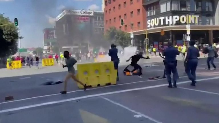 At least one person has died and two students have been injured in clashes between South African university students and police over tuition fees at the University of Witwatersrand in Johannesburg