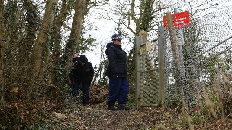 Police officers search woodland near to Great Chart Golf and Leisure country club and course in Ashford, Kent