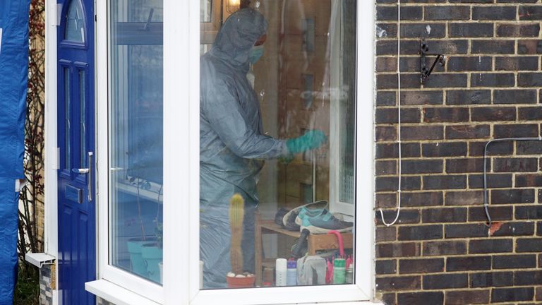 A forensic officer inside the house in Freemens Way in Deal, Kent