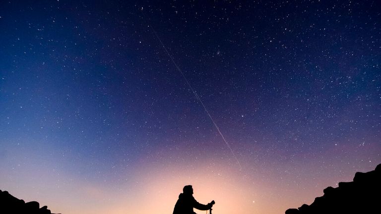 Starlink satellites are visible in the sky near Salgotarjan, Hungary, early Monday, Nov. 25, 2019. In this long exposure image the movement of satellites are seen as shining tracks. Each of the shining tracks were created by separate satellites making progress on their own orbits. The American rocket company SpaceX launched 60 new satellites on Monday, Nov. 11, 2019. (Peter Komka/MTI via AP)

