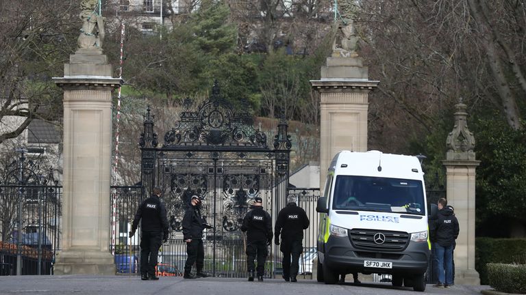 Police officers outside the Palace of Holyroodhouse in Edinburgh. Picture date: Wednesday March 24, 2021.

