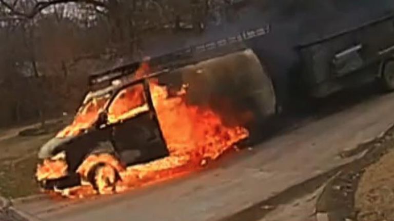 A flaming van rolled down a steep driveway and down a hill in Fayetteville, Arkansas, on March 10, just as police officers arrived to respond to the blaze
