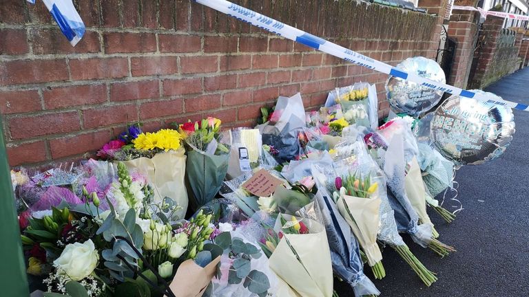 Flowers have been left outside the family home where he died