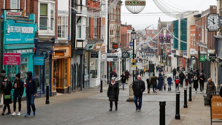 People walk at High Street, amid the coronavirus disease (COVID-19) outbreak, in Windsor, Britain January 10, 2021. 
