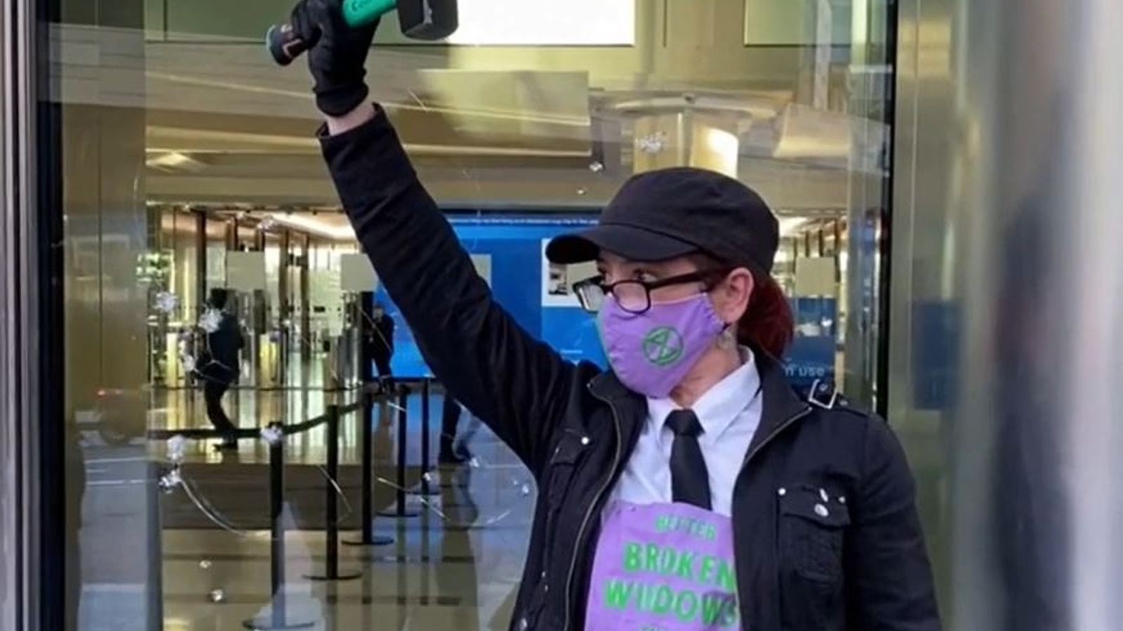 Extinction Rebellion activists smash windows at Barclays' London HQ ...