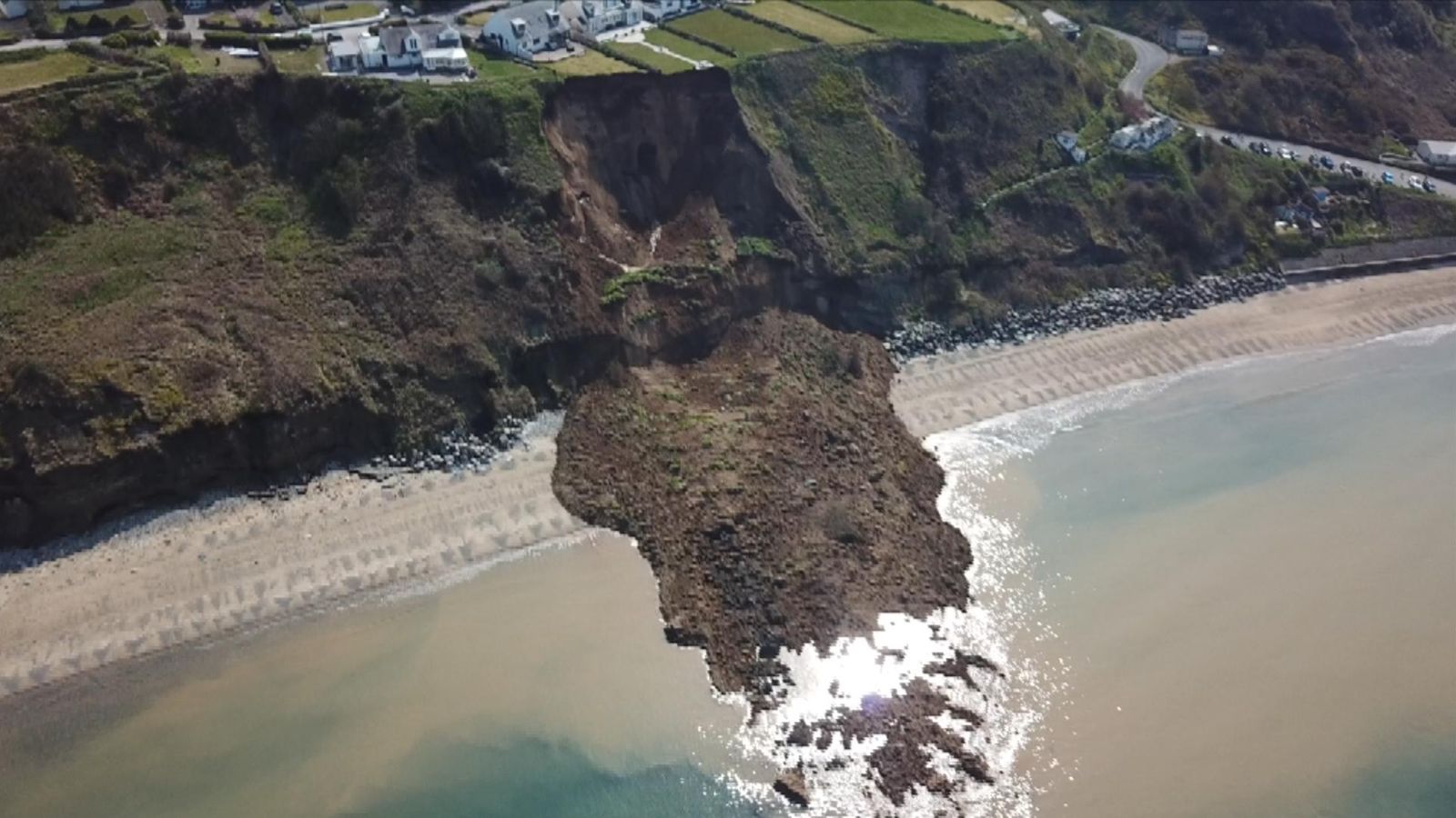 Huge landslide blocks beach in north Wales | UK News | Sky News