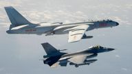 A Taiwanese Air Force F-16 in foreground flies on the flank of a Chinese People&#39;s Liberation Army Air Force (PLAAF) H-6 bomber as it passes near Taiwan. Pic: AP