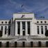 Federal Reserve prepares to scale back pandemic support - but cuts growth forecast