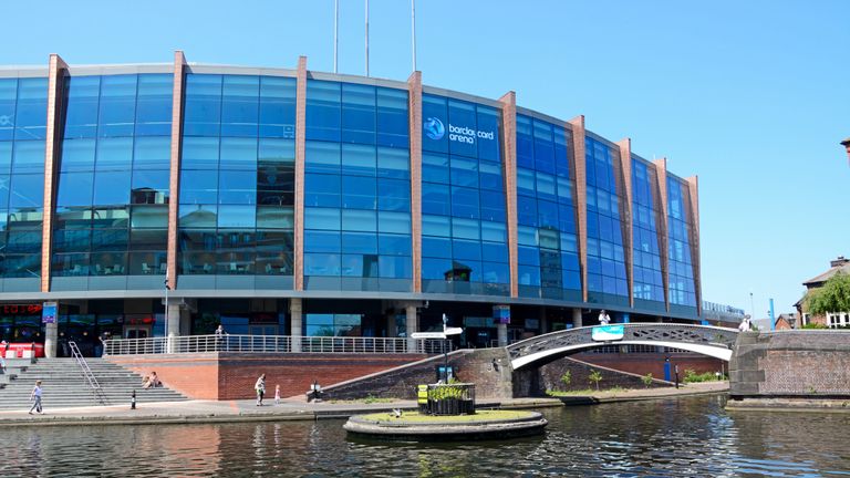 Birmingham, United Kingdom - June 6, 2016: View of the National Indoor Arena aka the Barclaycard Arena at Old Turn Junction with people passing by, Birmingham, England, UK, Western Europe.