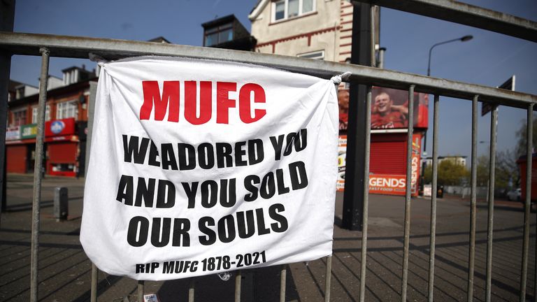 A banner left by Manchester United fans objecting to the clubs decision to join the European Super League, Sir Matt Busby Way, Manchester. Picture date: Tuesday April 20, 2021.