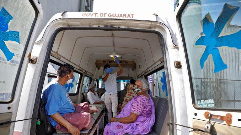 Patients are seen inside an ambulance while waiting to enter a COVID-19 hospital for treatment, amidst the spread of the coronavirus disease (COVID-19) in Ahmedabad, India, April 22, 2021. REUTERS/Amit Dave