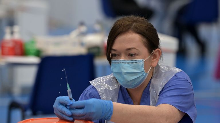 A nurses prepares a vaccine jab at the Lakeland Forum vaccination centre in Enniskillen, Northern Ireland, during a visit from Prime Minister Boris Johnson. Picture date: Friday March 12, 2021.