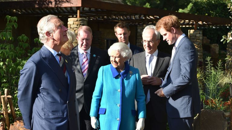 The Prince of Wales (left), Queen Elizabeth II and Prince Harry (right), in the Sentebale Garden, with Philip Green (second right) and David Brownlow (third left), who are main supporters of the Lesotho Sentabale Charity and the Chelsea Garden and the Garden's designer Matt Keightlry (rear) at the annual Chelsea Flower show at Royal Hospital Chelsea in London.