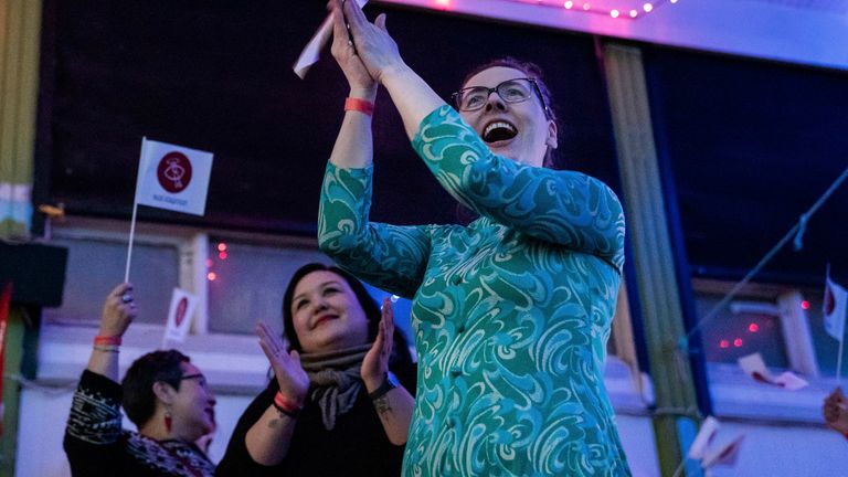 Members of IA (Inuit Ataqatigiit) celebrates following the exit pools at the Greenland election in Nuuk April 6, 2021