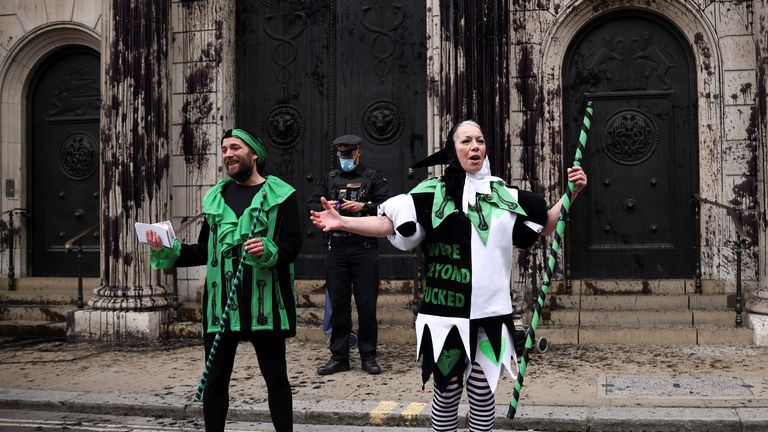 SENSITIVE MATERIAL. THIS IMAGE MAY OFFEND OR DISTURB Activists from the Extinction Rebellion, a global environmental movement, protest outside the Bank of England, in London, Britain, April 1, 2021. REUTERS/Henry Nicholls
