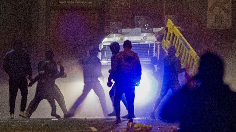 Rioters clash with police in the Sandy Row area of Belfast. Picture date: Friday April 2, 2021.
