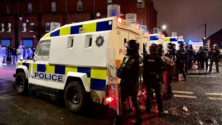 PSNI officers on the nationalist side of the Springfield Road in Belfast on Wednesday