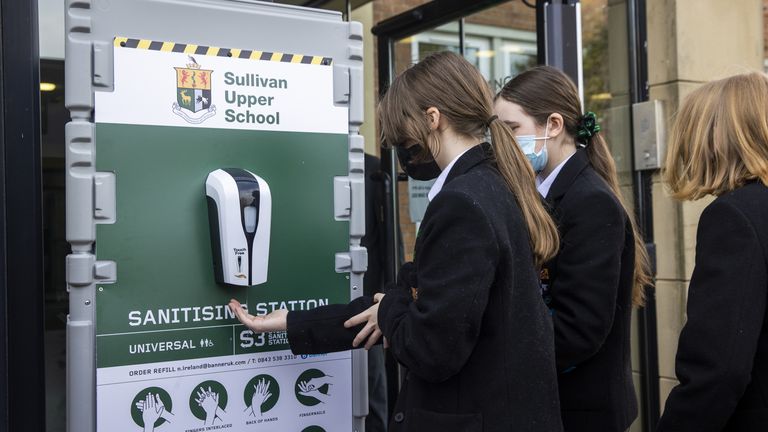 Pupils use a hand sanitisation station at Sullivan Upper School in Holywood