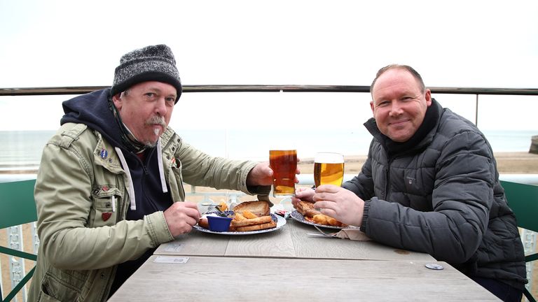 Gary Gearing (left) and Lee Cooper enjoy their breakfast and a pint at the Royal Victoria Pavilion in Ramsgate, Kent