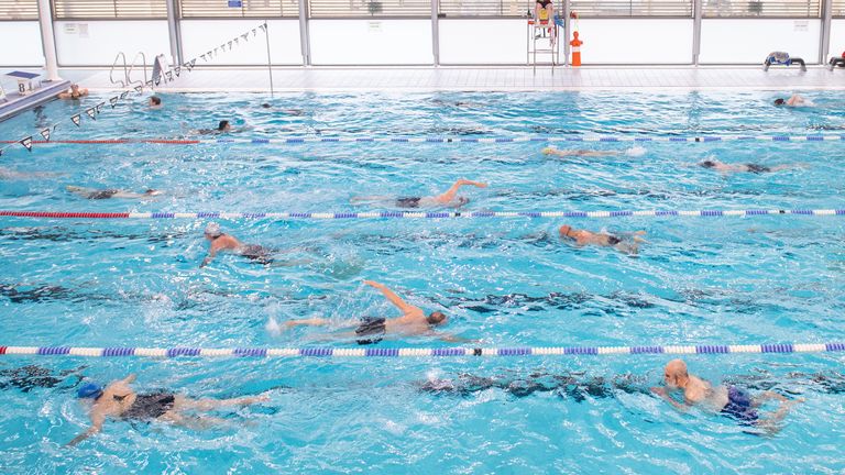 Swimmers returning to the pool at Clissold Leisure Centre, north London