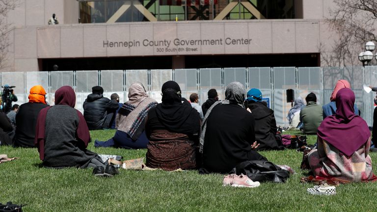 The Minnesota branch of the Council on American-Islamic Relations holds Friday prayers outside a government building in Minneapolis