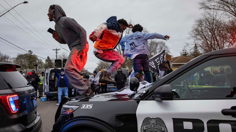 Police cars were vandalised during the protests