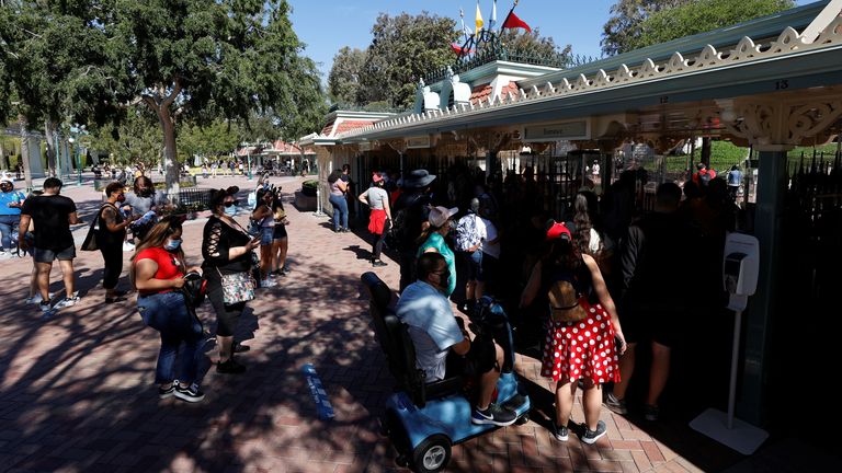 People walk outside Disneyland Park on its reopening day amidst the coronavirus disease (COVID-19) outbreak, in Anaheim, California, U.S.