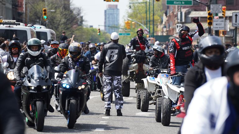 Fans gather to pay tribute outside a memorial to celebrate the life of late U.S. rapper and actor Earl Simmons, known by his stage name DMX, outside the Barclays Center in Brooklyn, New York City, U.S., April 24, 2021. REUTERS/David &#39;Dee&#39; Delgado