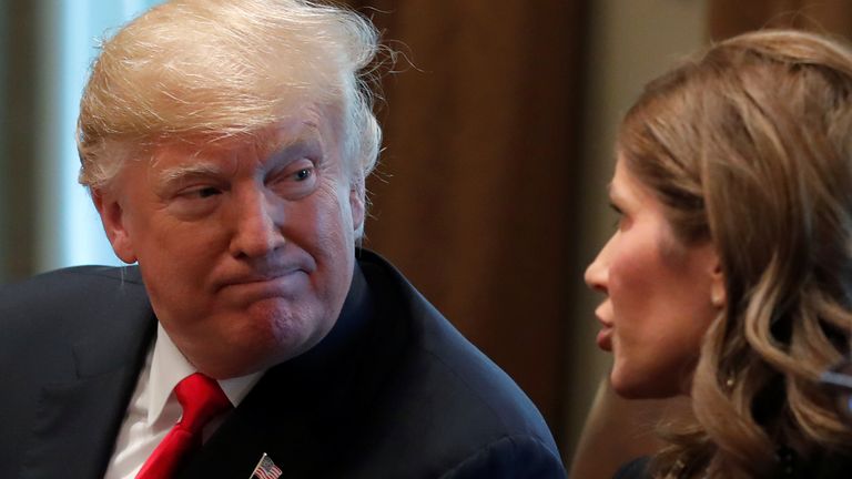 Donald Trump meets Kristi Noem in the Cabinet Room of the White House in 2018