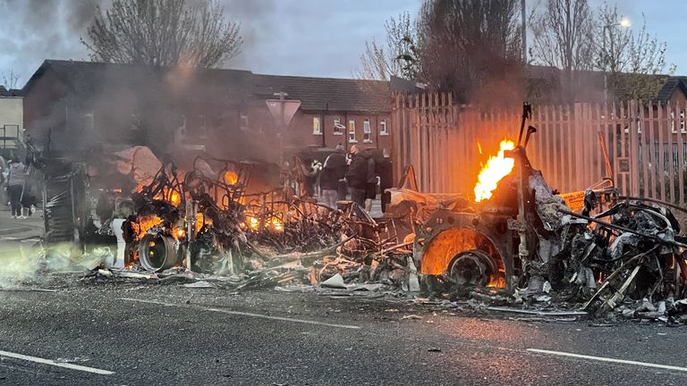 The wreckage of the bus set on fire in Belfast