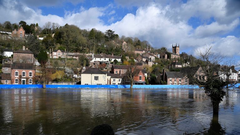 Flood defences, like this temporary one on the River Severn, are a type of climate change adaptation