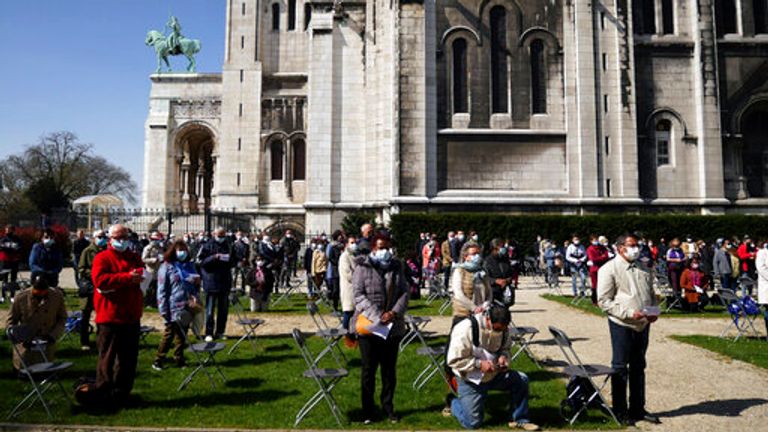 The faithful attend the Way of the Cross ceremony in the Sacre Coeur Basilica, in Paris